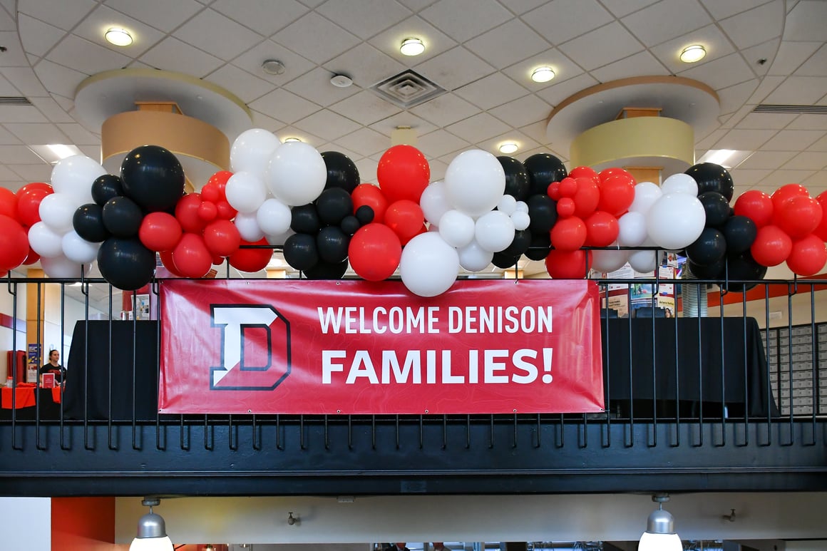 A photo of a banner hanging in Slayter Hall that reads "Welcome Denison Families!"
