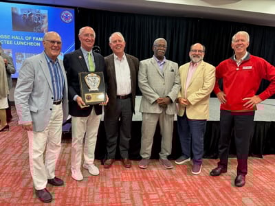 Steve Nazaruk ’73 poses for a photo with friends who joined him to celebrate his recent induction into the Ohio Lacrosse Hall of Fame