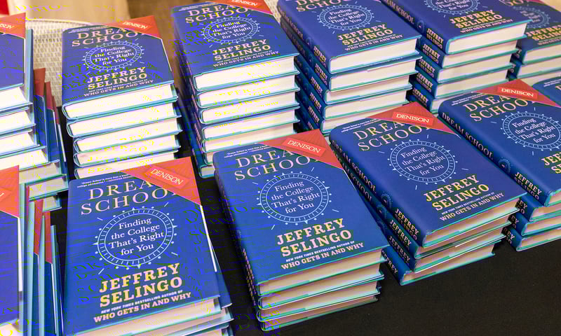 A photo of stacks of Jeffrey Selingo’s book, Dream School.