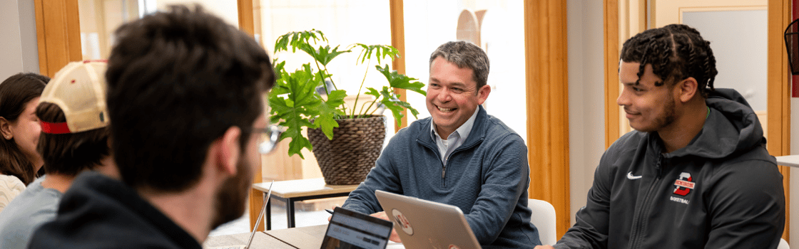 A photo of Denison students engaging with a staff member.